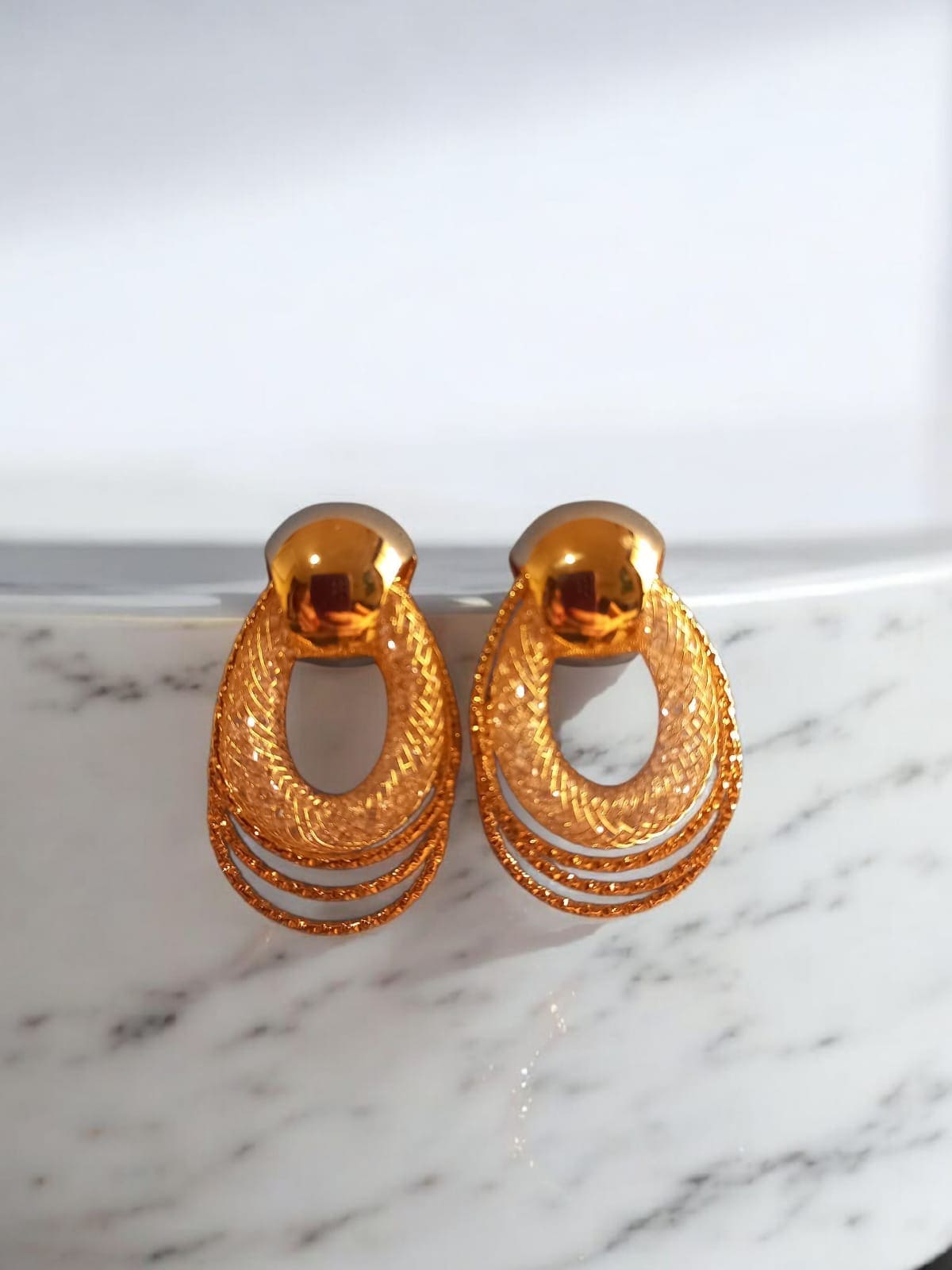 Brinco circular folheado à ouro 18 k.jpg