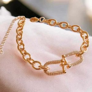 Pulseira união cravejada em zircônias folheado à ouro